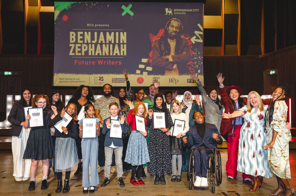 The winners and judges of the Future Writers Awards 2025 celebrate their achievements in front of the Benjamin Zephaniah backdrop