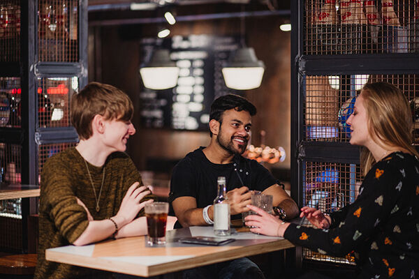 Students socialising in a bar