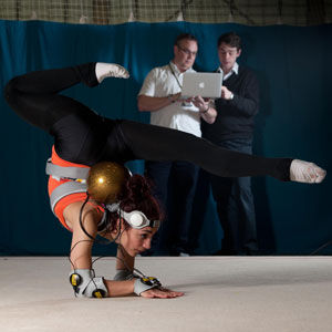 Olympic hopeful, gymnast Mimi Cesar tests out the vibrating suit
