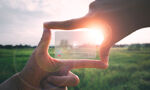 Hands around a transparent floating media player