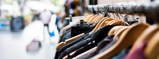 Clothes hanging on a rail in a high street shop