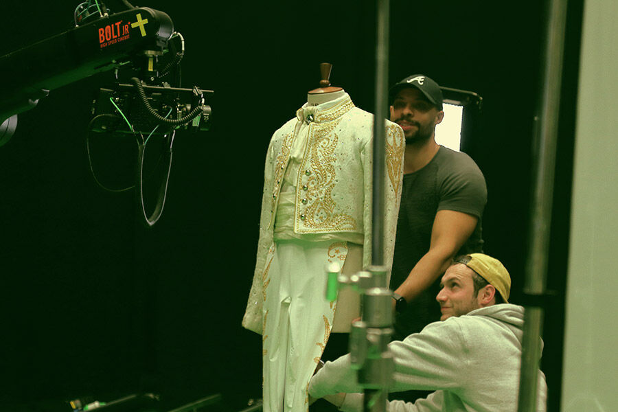 Students stood behind costume for camera shoot