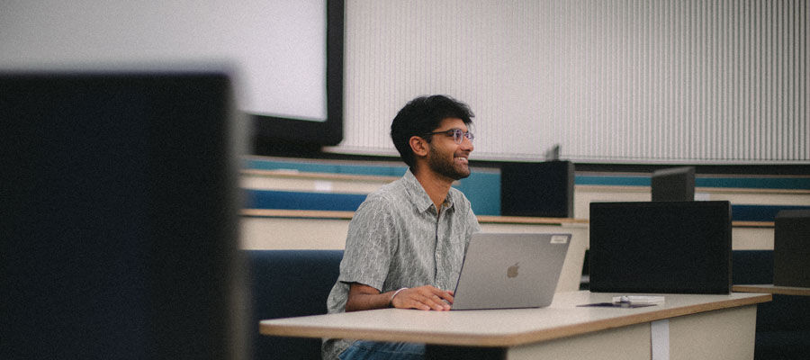 A student sits in a lecture theatre
