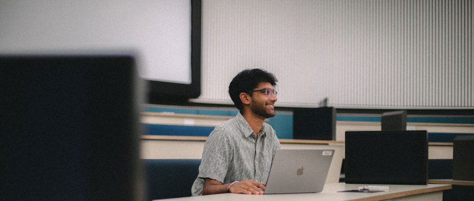 A student sits in a lecture theatre