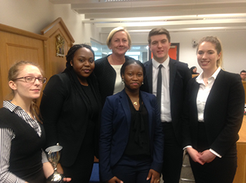 Emma Cole receiving her award from Lesley Anderson QC Internal Mooting Final