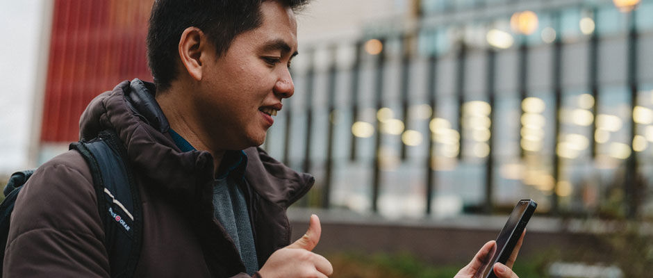 student using mobile phone