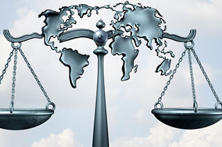 International Mobility 700x350 - Scales of justice with a map of the world on it
