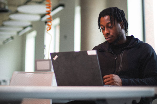 A student working on their laptop