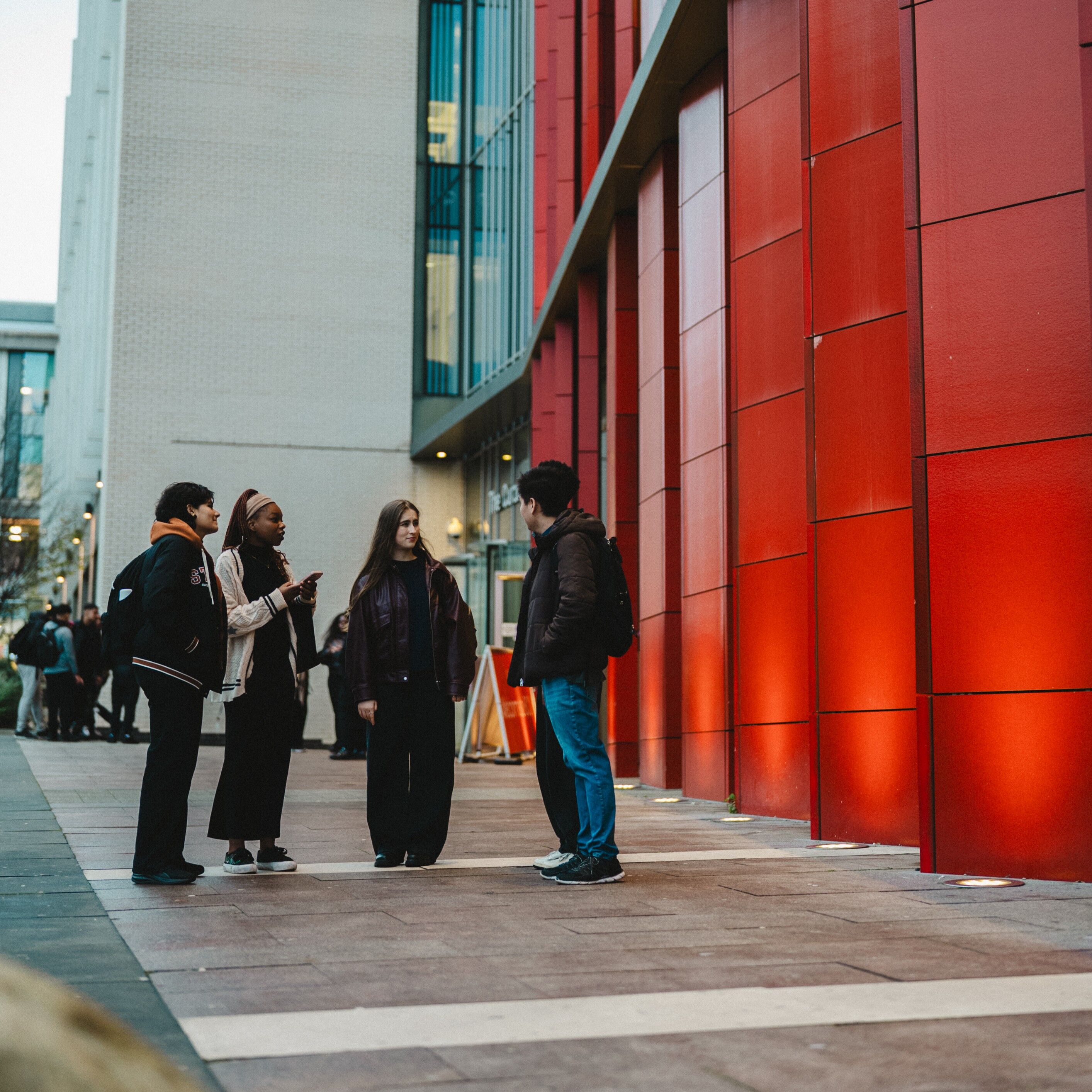 A group of students chatting on campus