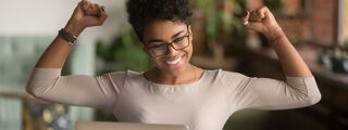 Is online university study worth it 1200x450 - Woman with a laptop cheering