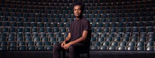 Janeel Brown sitting in empty theatre