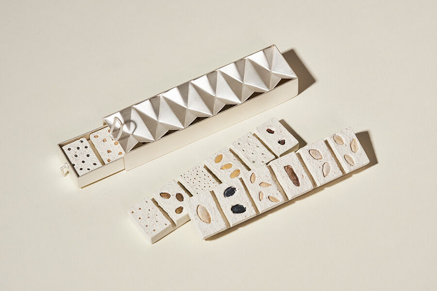 Jewellery and Objects student work -- white tiles with seeds