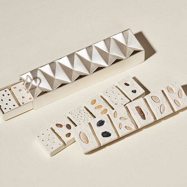 Jewellery and Objects student work -- white tiles with seeds