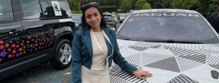 Lavanya stood next to Jaguar car