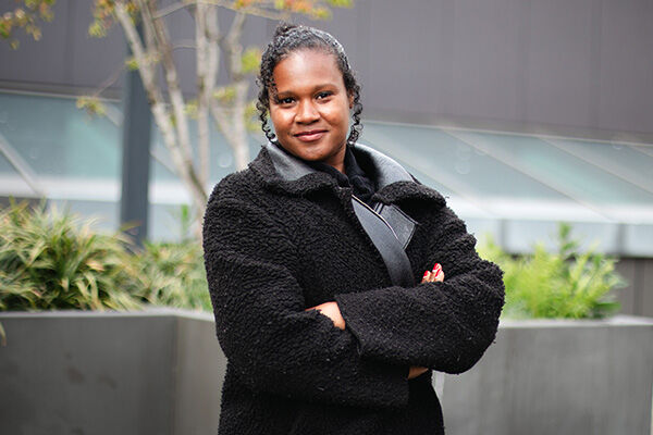 Black female PGR standing outside