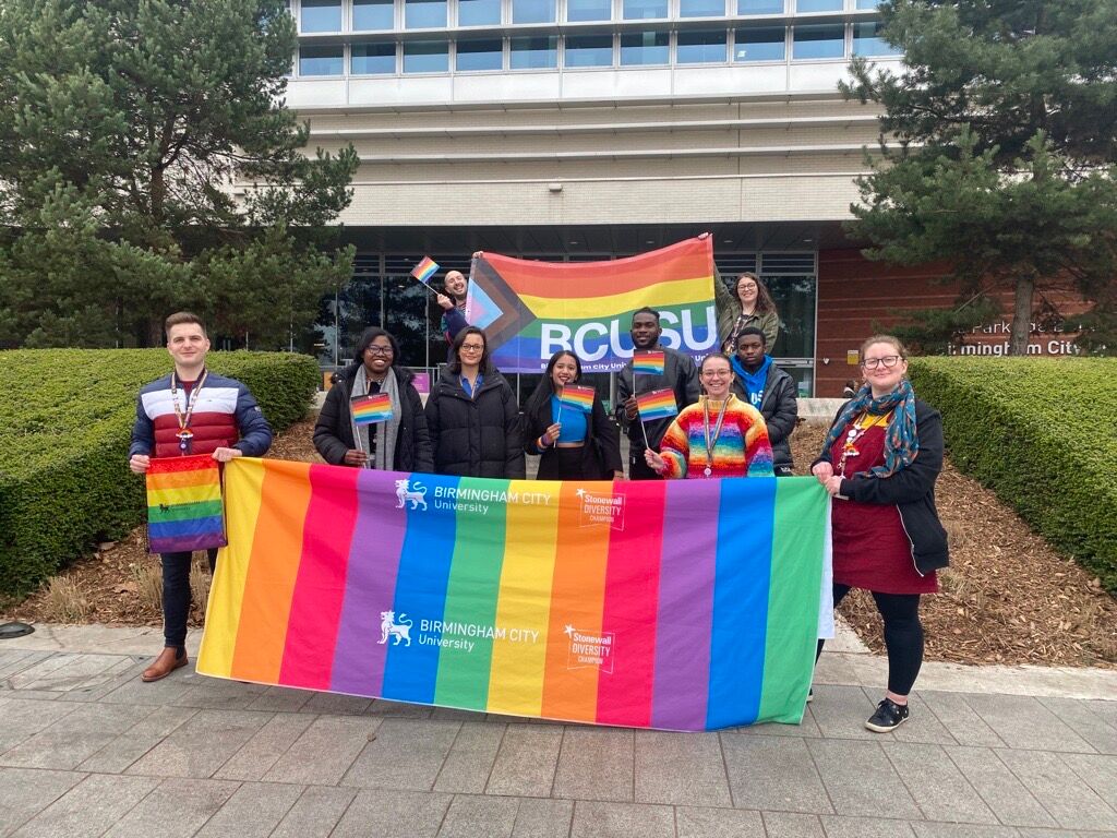 LGBT History Month 2023 - students holding banners and flags