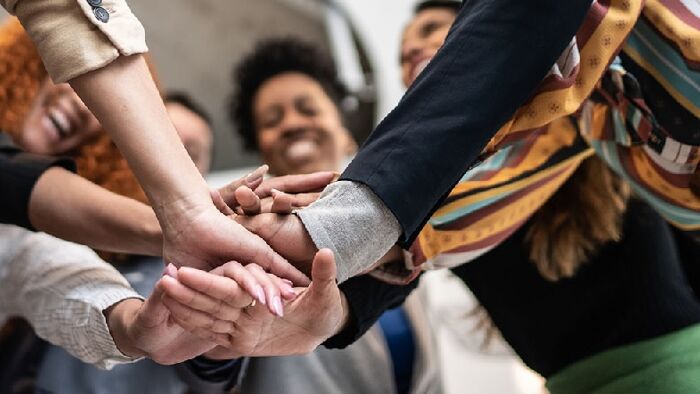 Partnership - people with hands in the middle