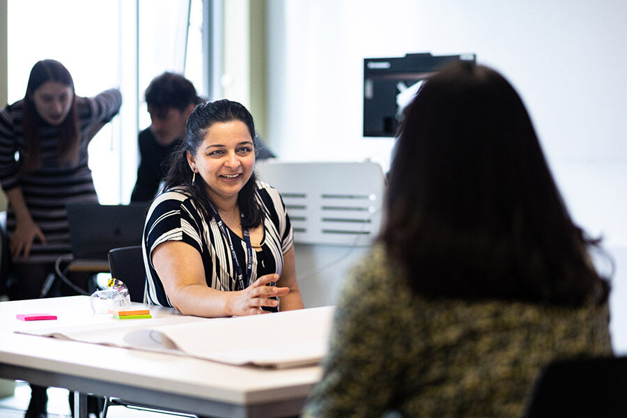 MA Design Management staff member in discussion with student