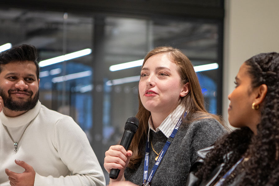 MA Design Management students in teaching session student answering question