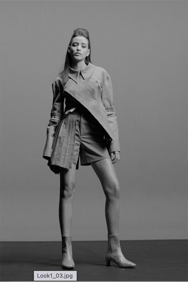 Model in long coat and glittery boots