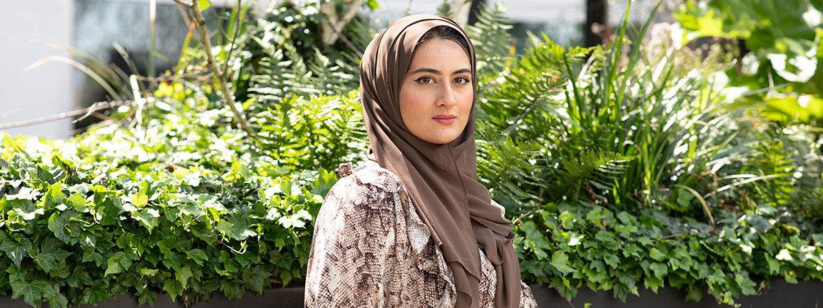 Maryam looks towards the camera
