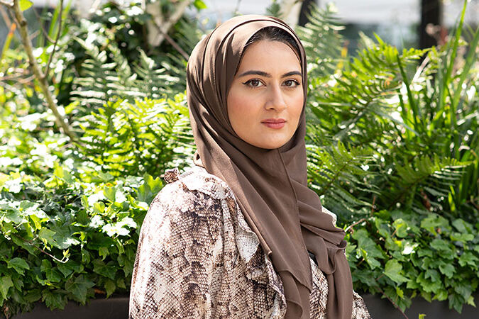Maryam looks towards the camera