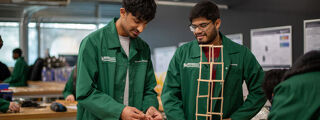 Students building towers with Lollipop sticks