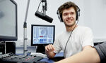 Students talking in a radio suite