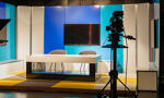 Photo of a studio with a interview set created