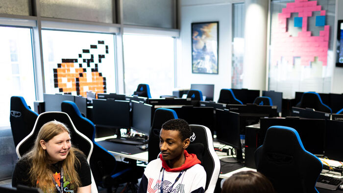 Students using computers in a computer games workshop