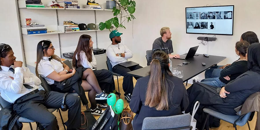 Students talking at desk