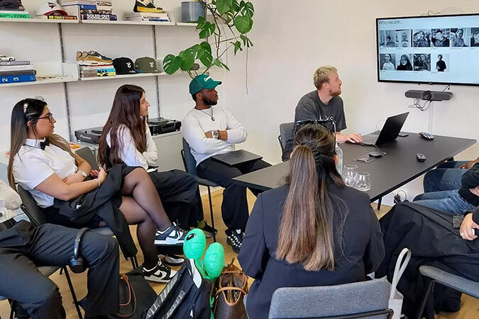 Students talking at desk
