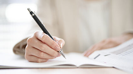 Writing on paper with pen