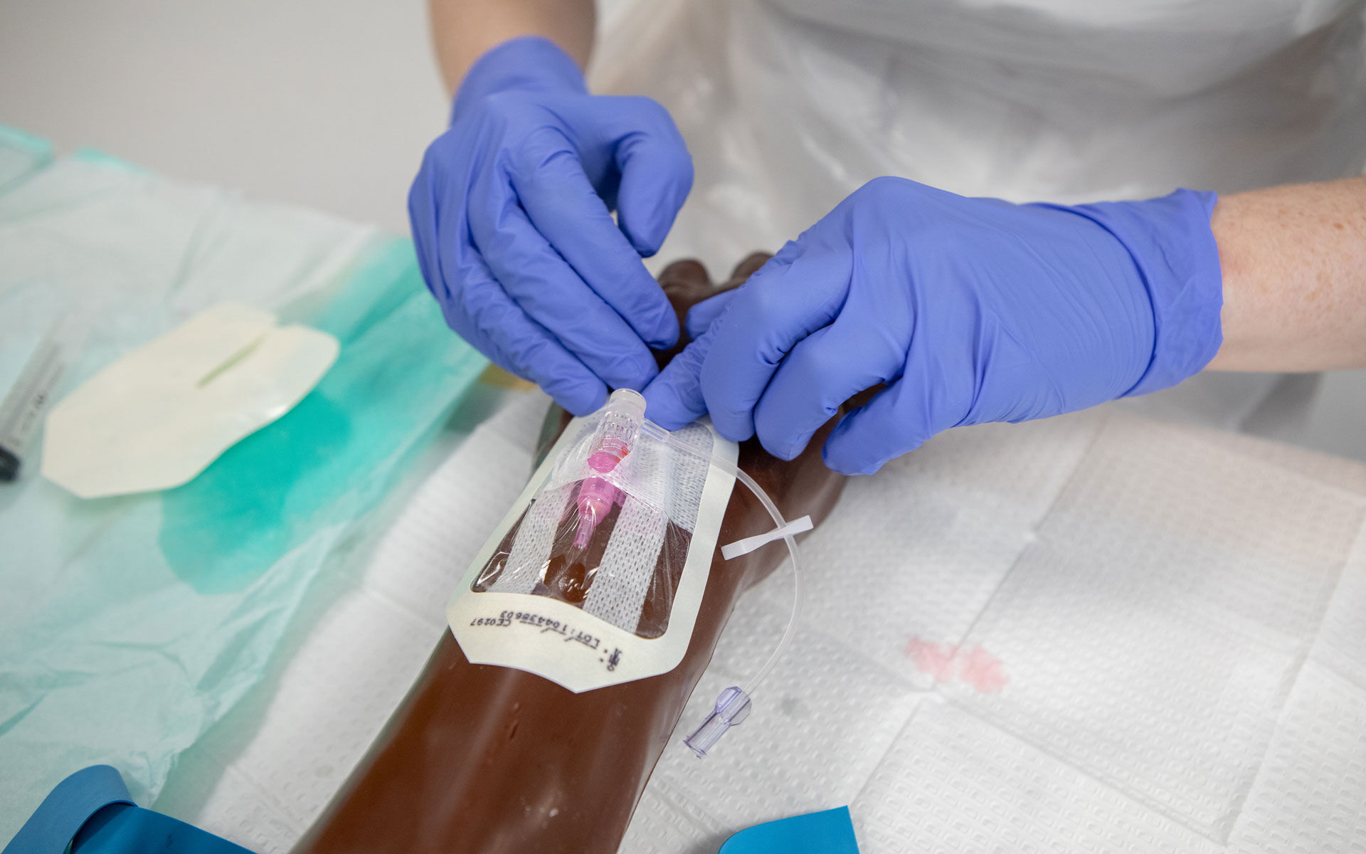 A nurse inserts a canula
