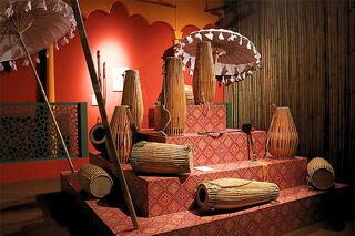 Dhol drums and parasols on a dais