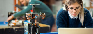 A part-time PhD student using her technology research in the workplace.
