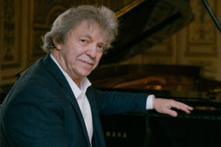 Pianist Pascal Rogé at the piano