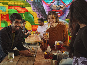 Students drinking and talking in a beer garden