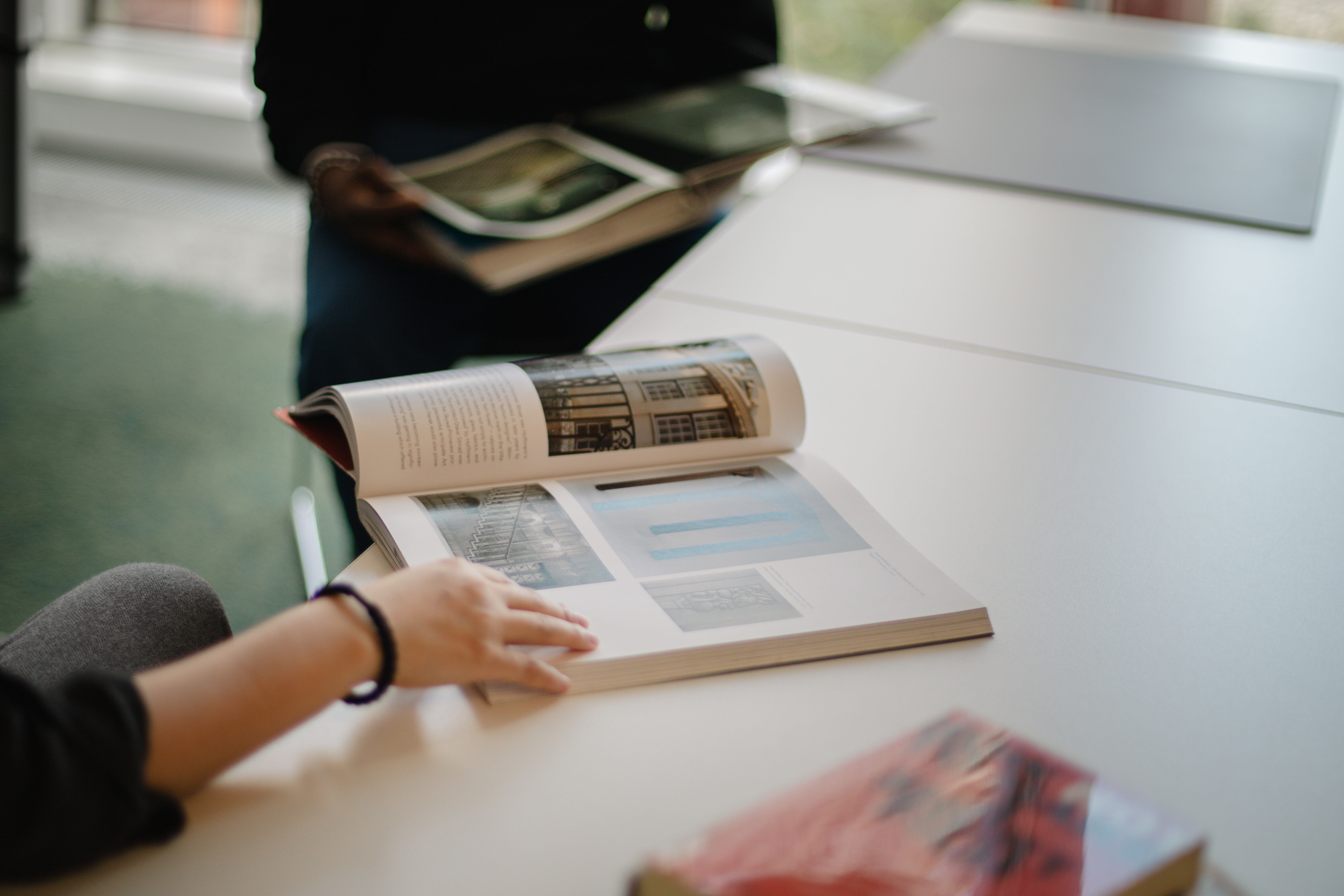 three students in the library