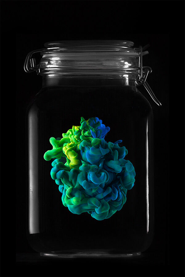 Photography piece of colourful animation in glass container