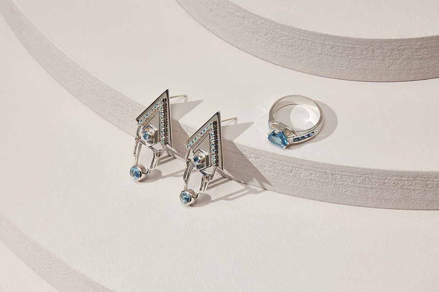 Jewellery and Silversmithing HND student work of silver ring and earrings with blue jewel