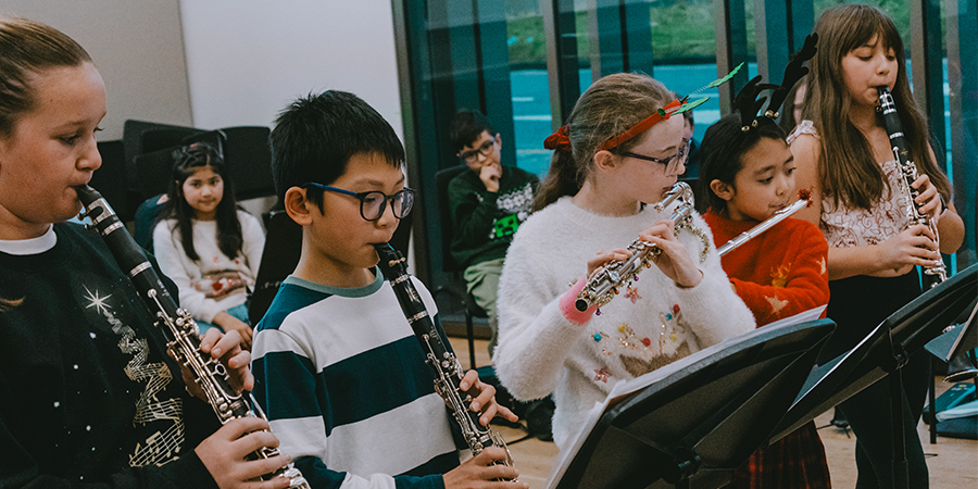 A group of children playing musical instruments