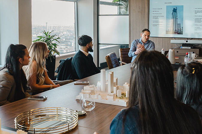 Sitting in a presentation room in Alpha Tower