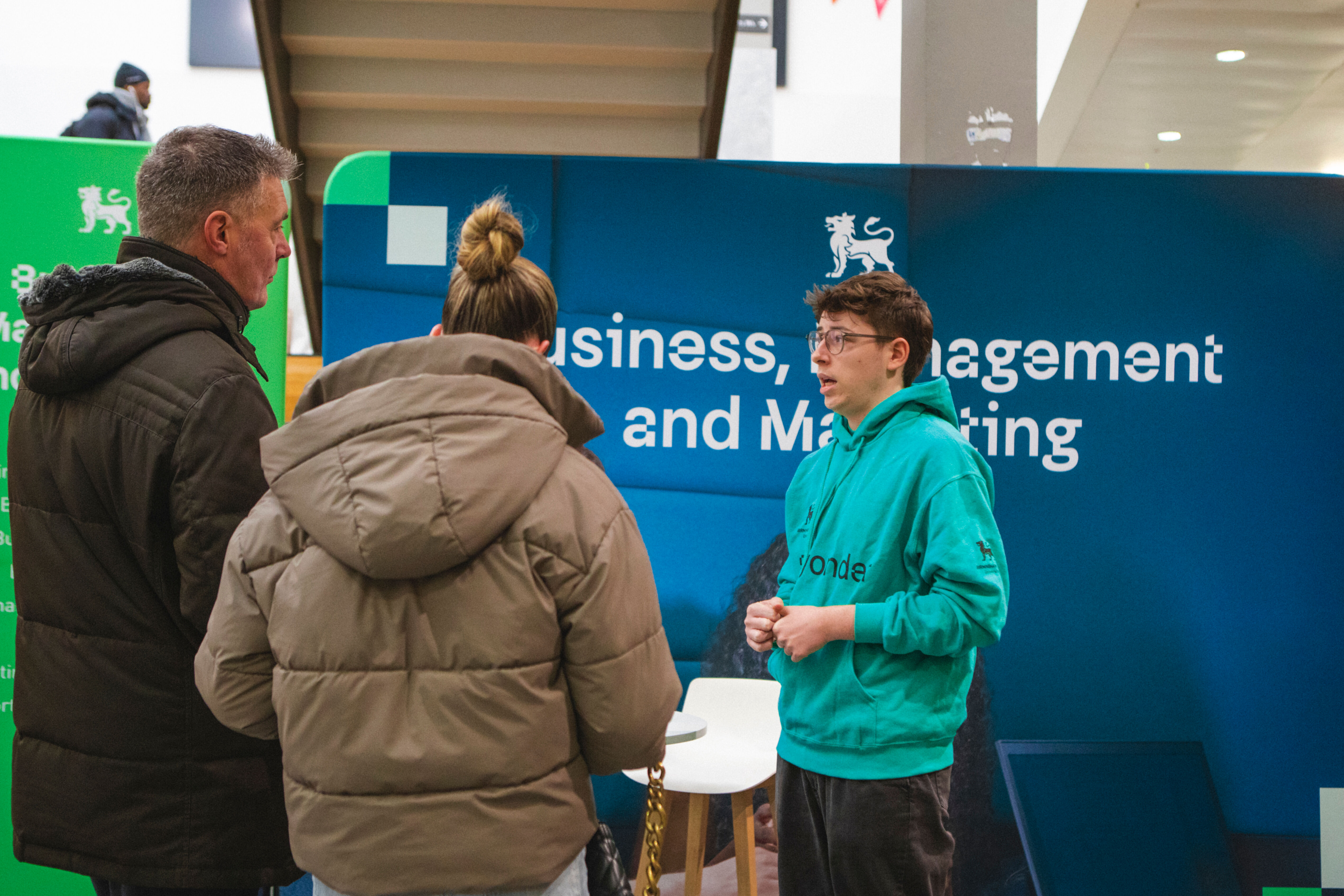 Student Job at Open Day in Green Jumper