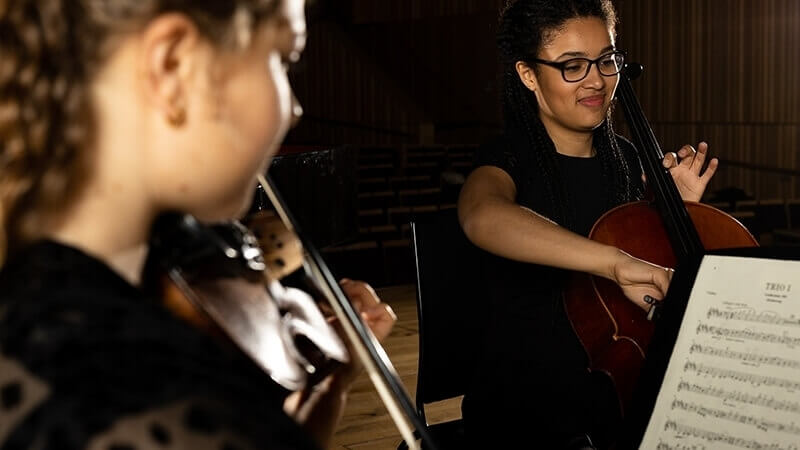 Two people playing instruments