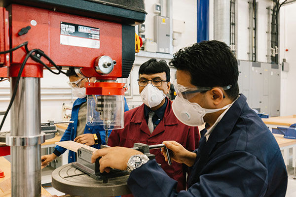 Technicians working in engineering facilities