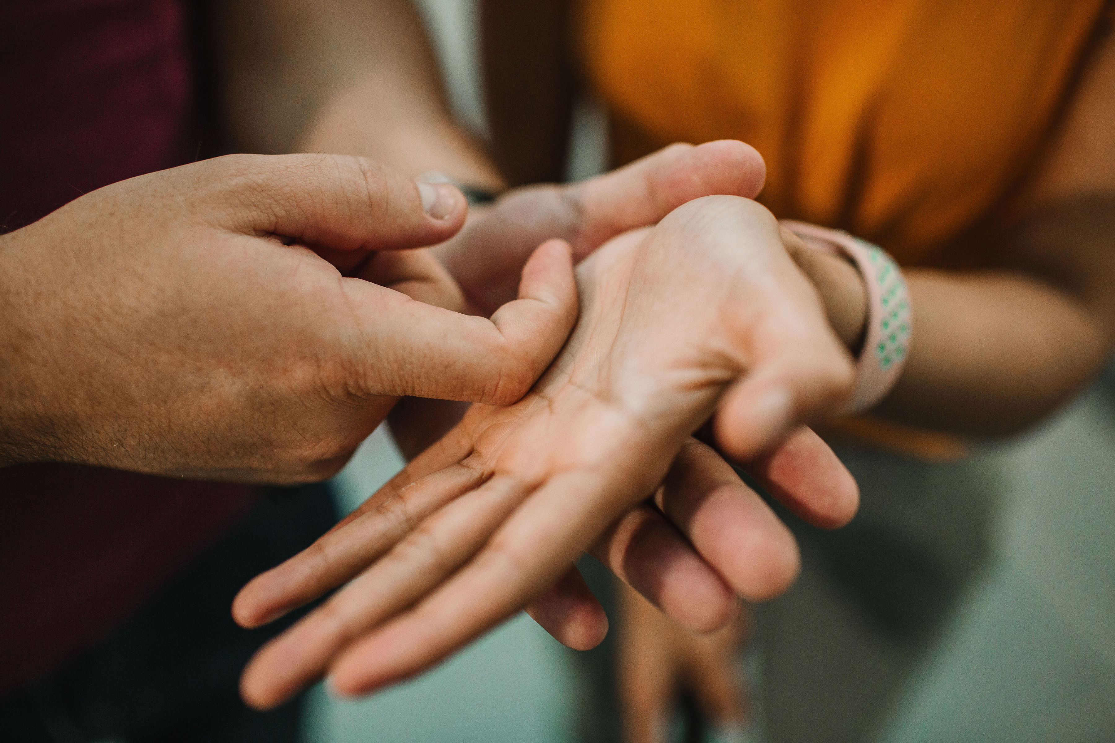 Two hands together touching for finger spelling