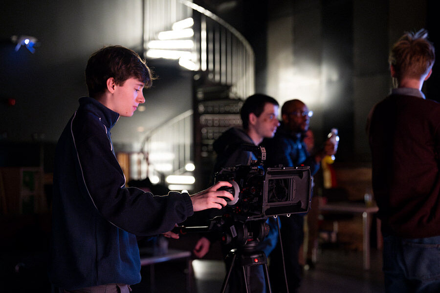 Student working camera in studio
