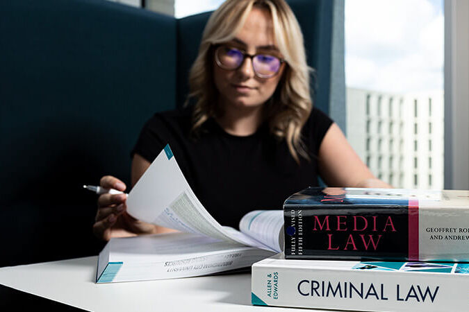 Student with Law textbooks
