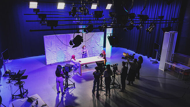 Aerial shot of students working in film studio